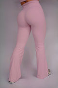 Woman wearing Luxòra Atelier's Bella Flare Set in Soft Rose – stylish pink activewear for gym and everyday wear.
