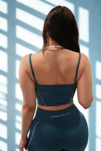 Back pose in Luxòra Atelier’s Nova Power Set – Deep Teal, highlighting supportive fit and bold style.